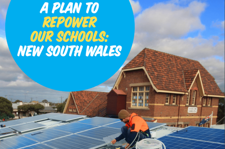 A man installs a solar panel on a rooftop.
